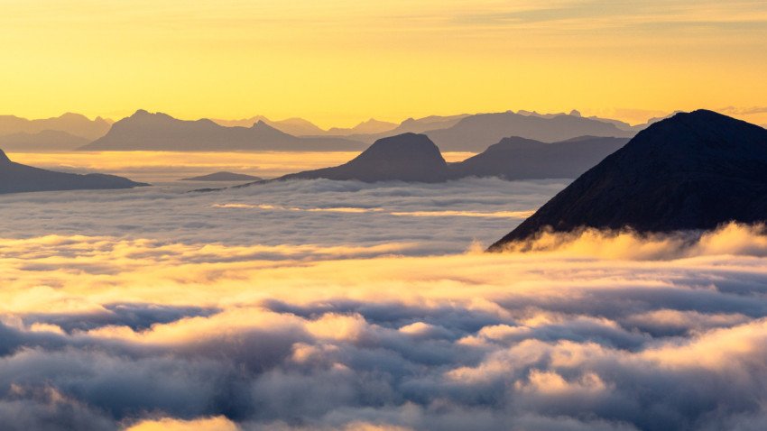 Mountains sticking out of inverse in a beautiful sunrise light free photo