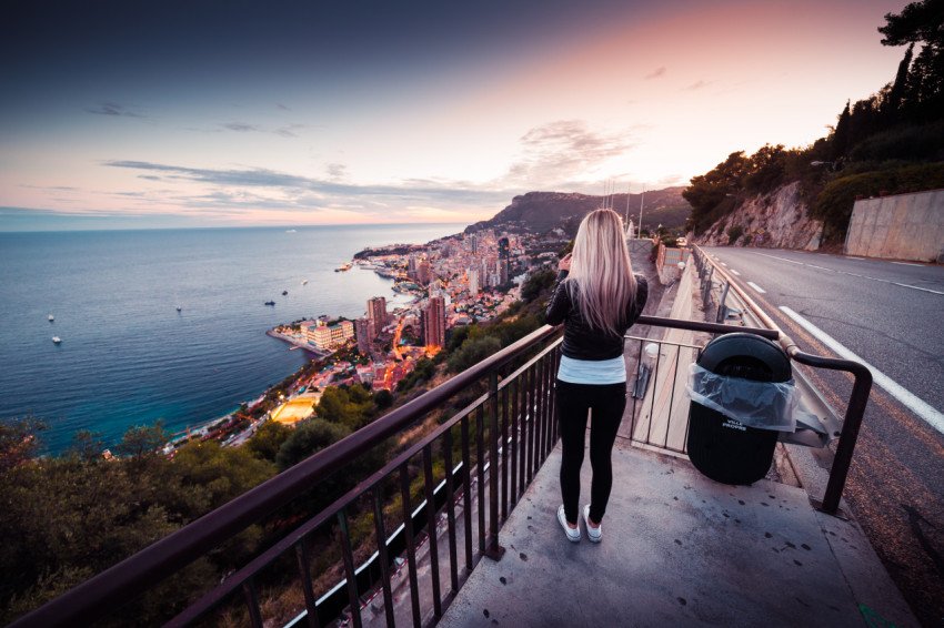 Young woman taking a picture of evening monaco free photo