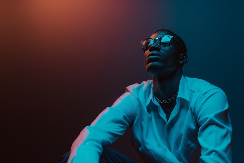 Studio artistic portrait of a relaxed man with fashion glasses free photo