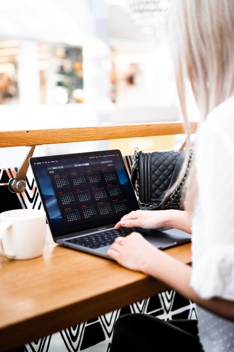 Young woman remote working in a cafe free photo